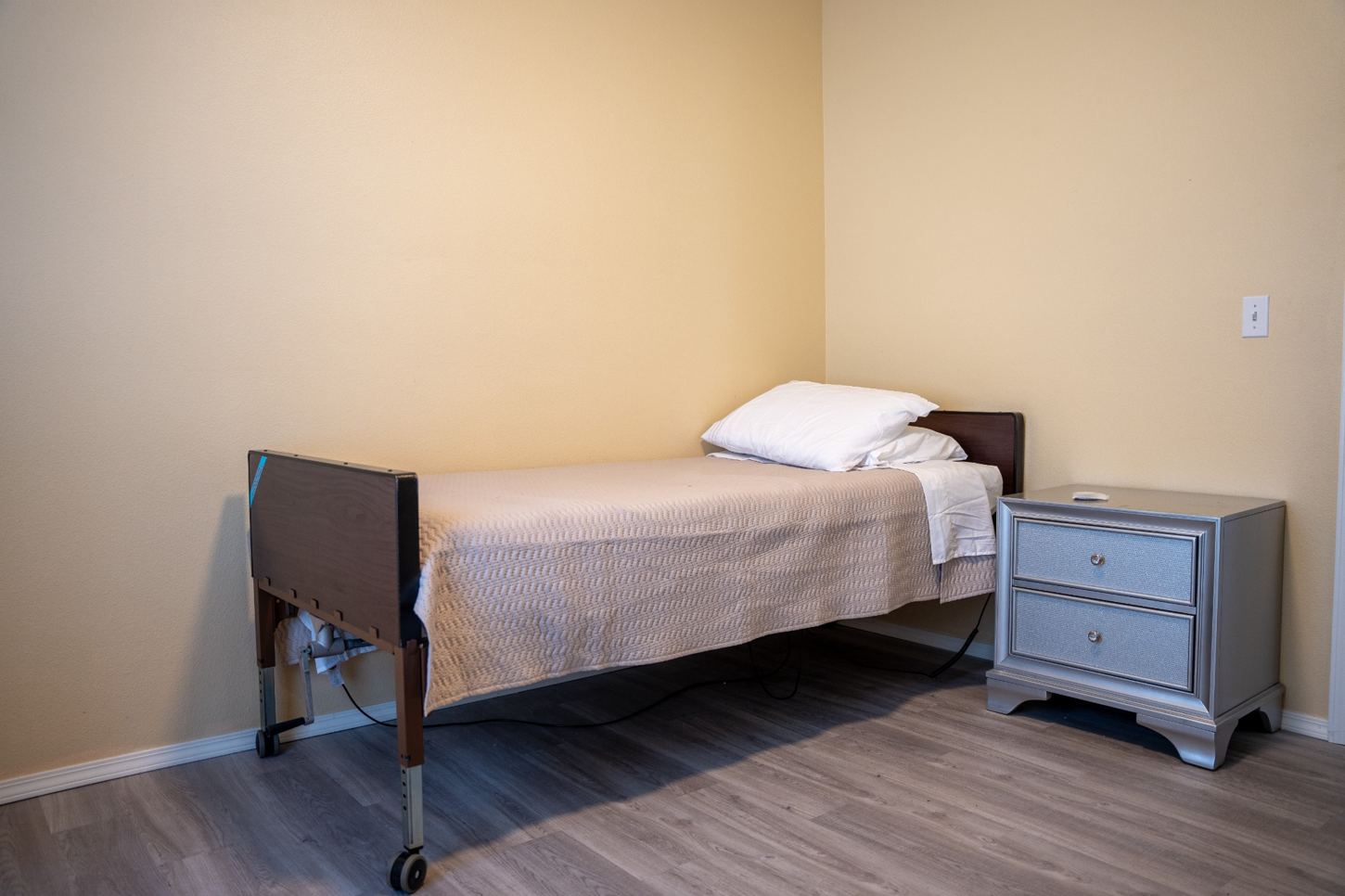 Private bedroom with bed and nightstand